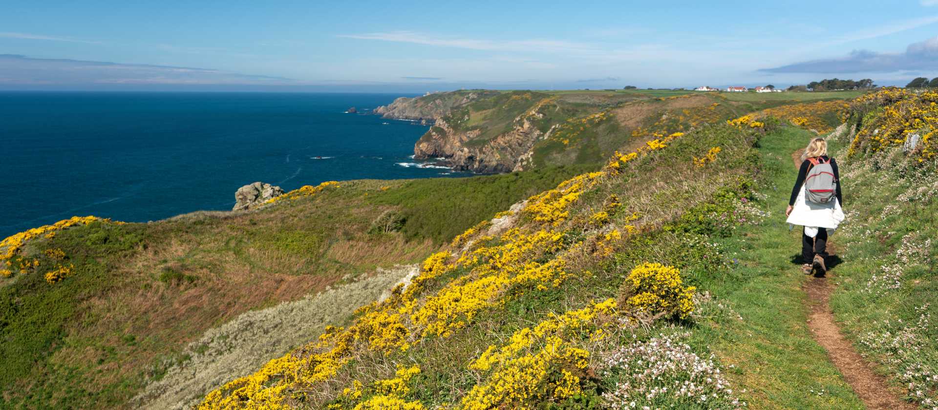 Hiking on a coastal path in Guernsey.