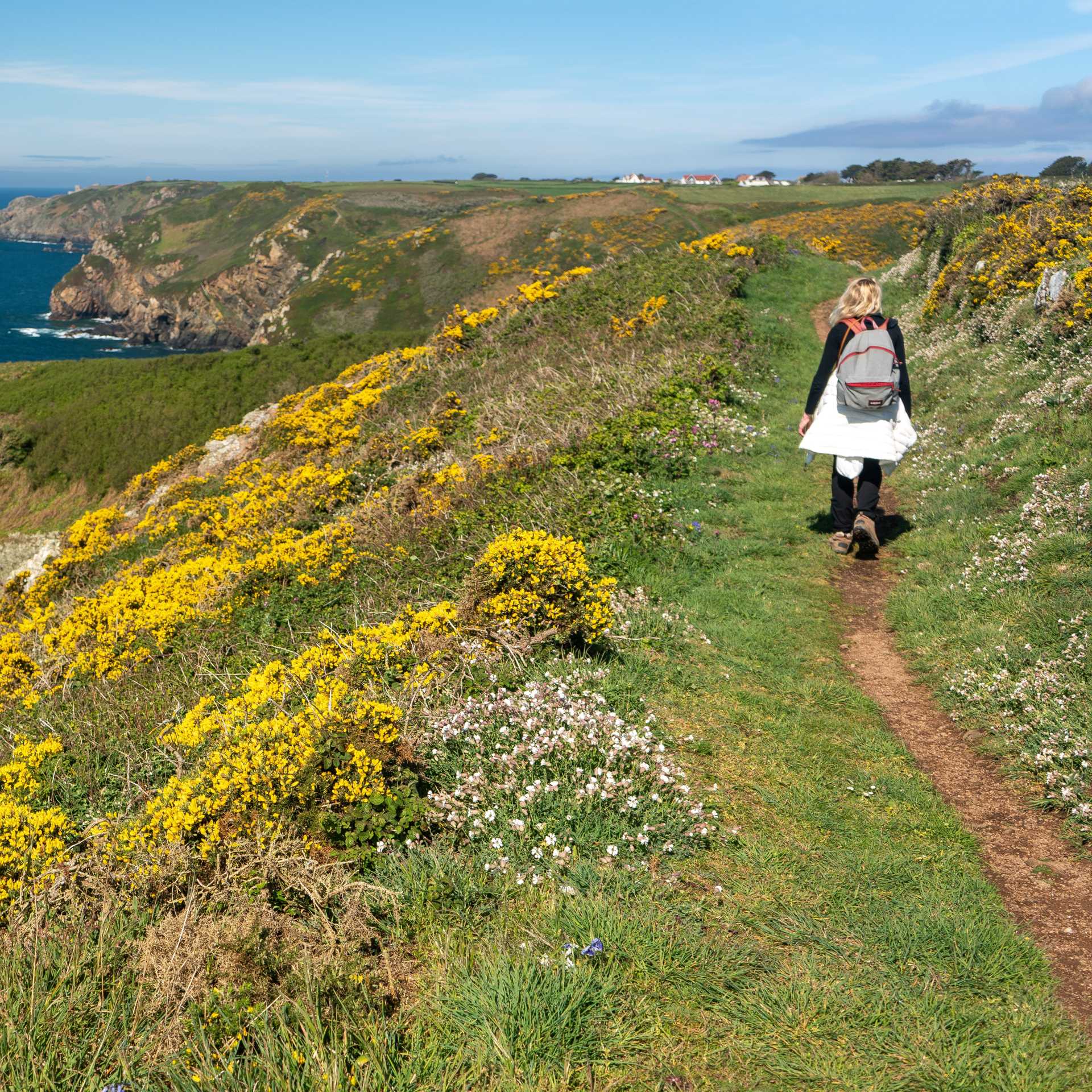 Hiking on a coastal path in Guernsey.
