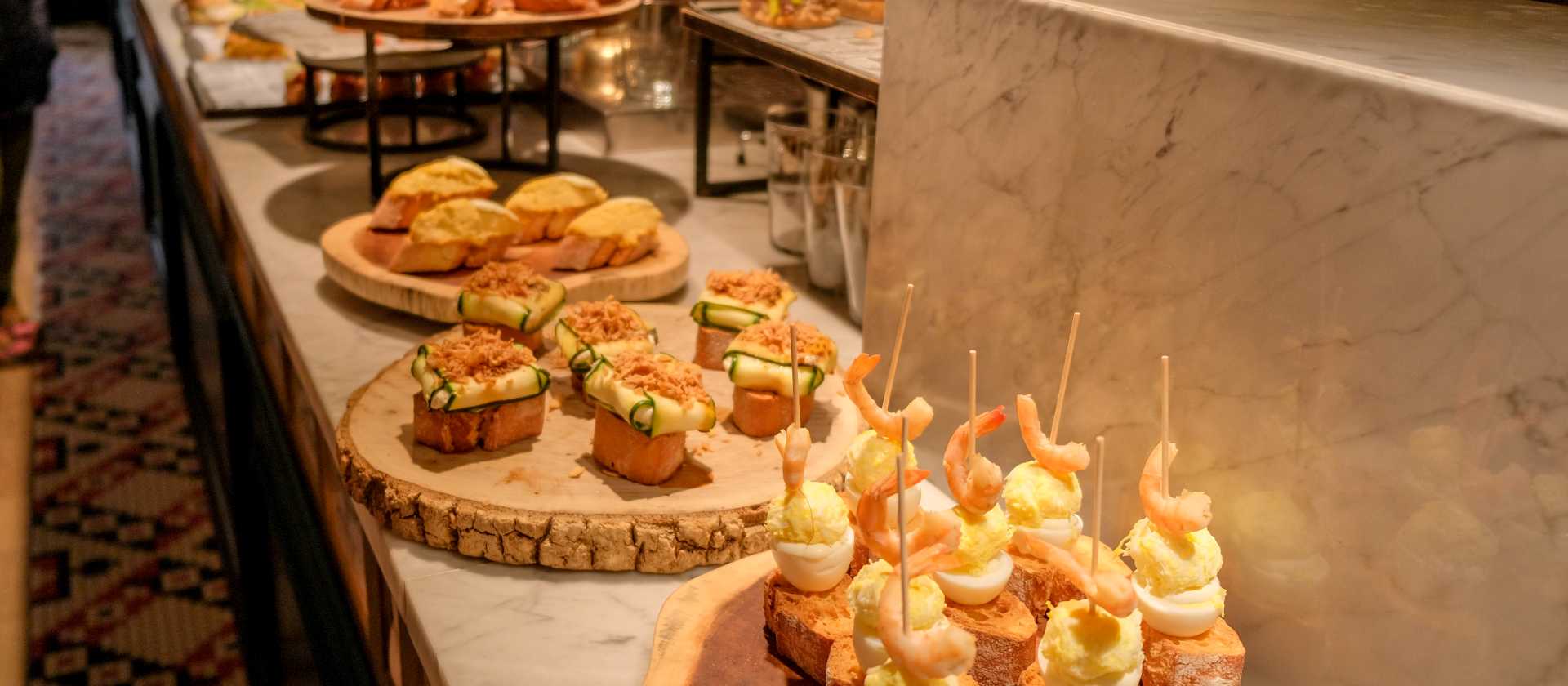 Try traditional pintxos (or tapas) at a bar in San Sebastian, Basque country, in Spain.