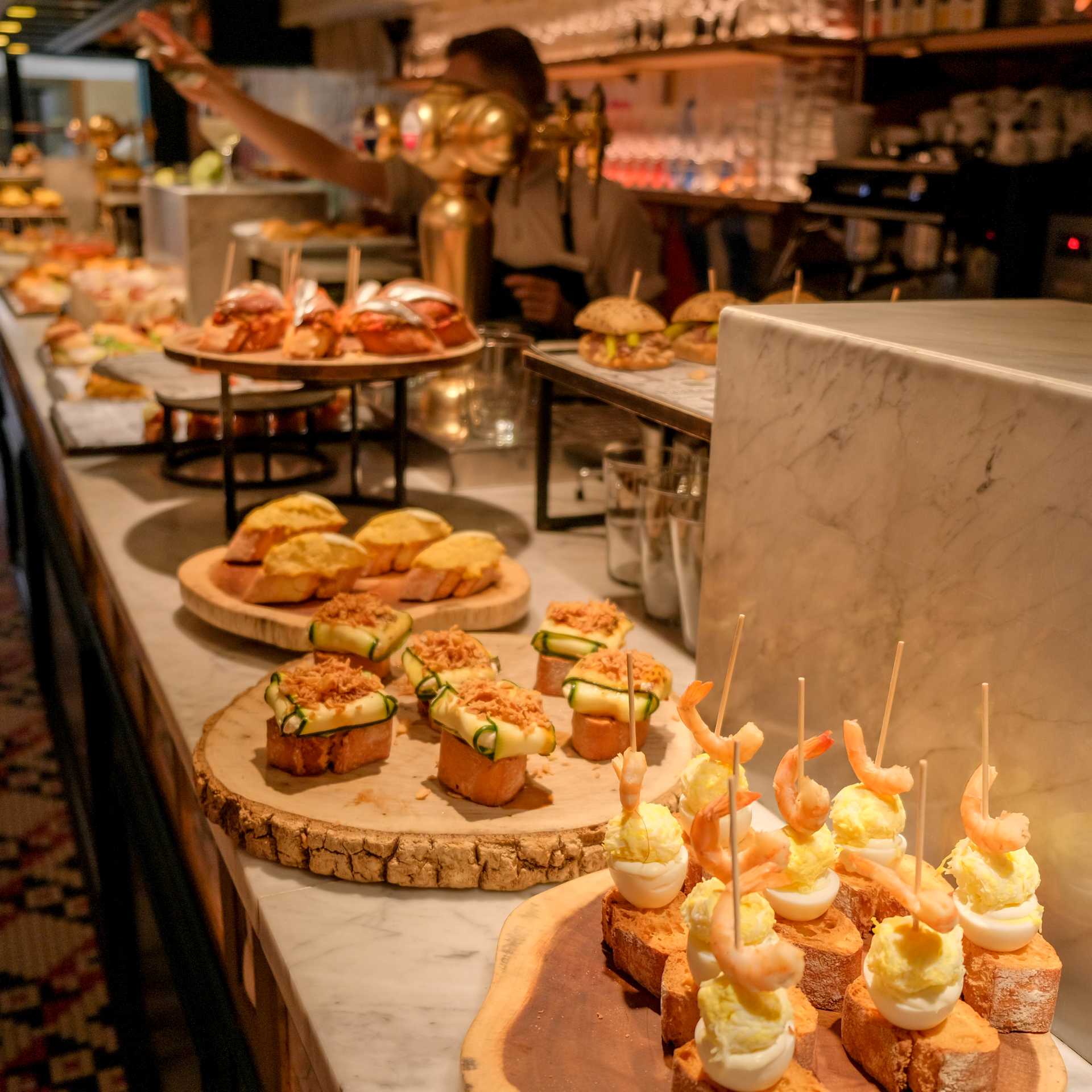 Try traditional pintxos (or tapas) at a bar in San Sebastian, Basque country, in Spain.