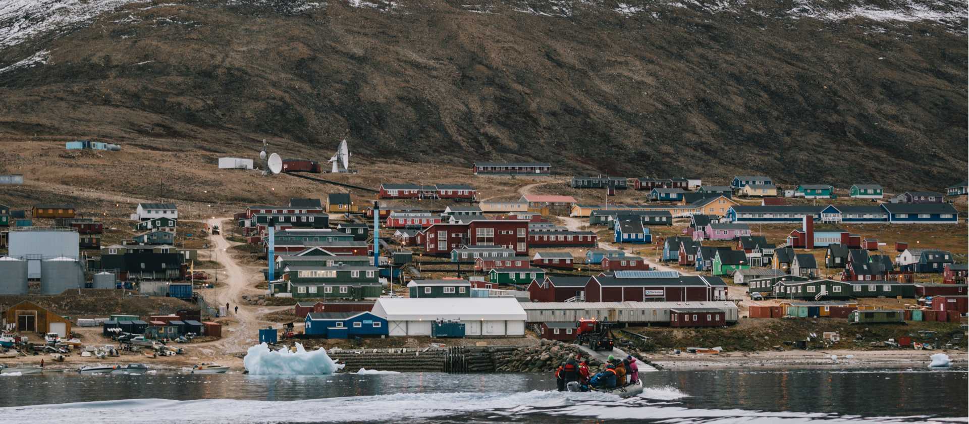 Colourful buildings and dramatic setting of Qaanaaq, Greenland | Liz Carlson