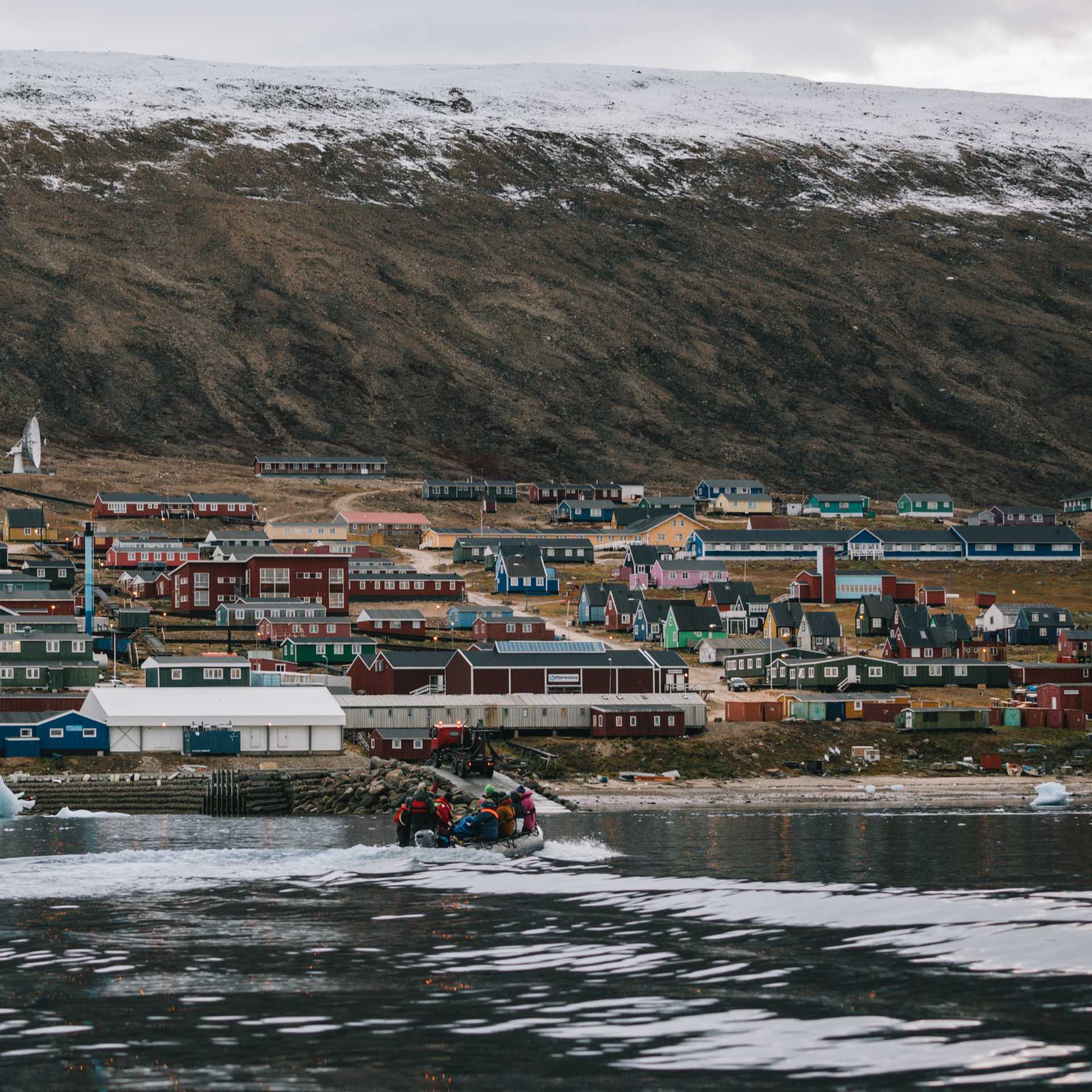Colourful buildings and dramatic setting of Qaanaaq, Greenland | Liz Carlson
