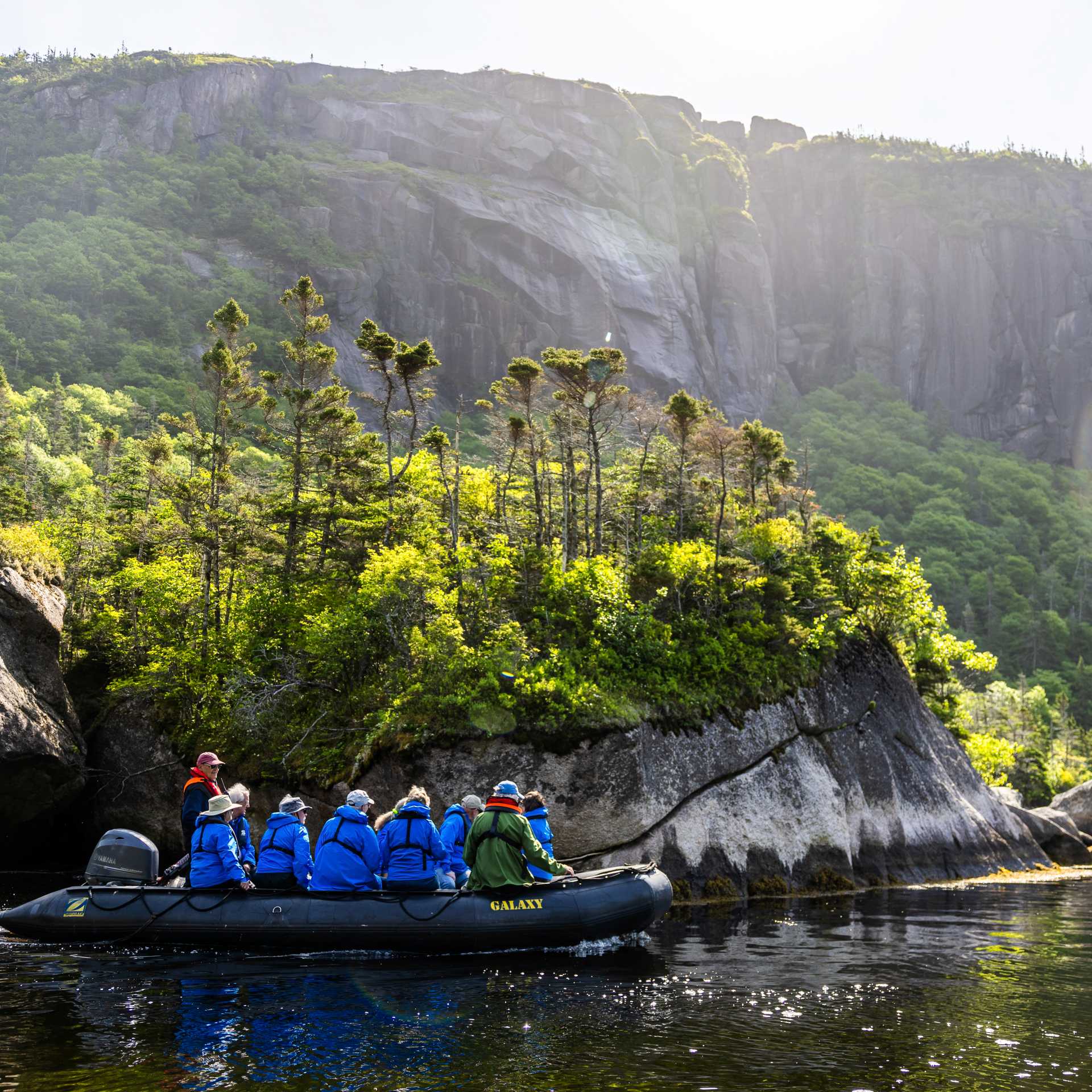 Travellers explore a dramatic landscape by Zodiac | Tom Cochrane