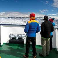 Explorers out on the bow of the Ortelius | Kyle Super