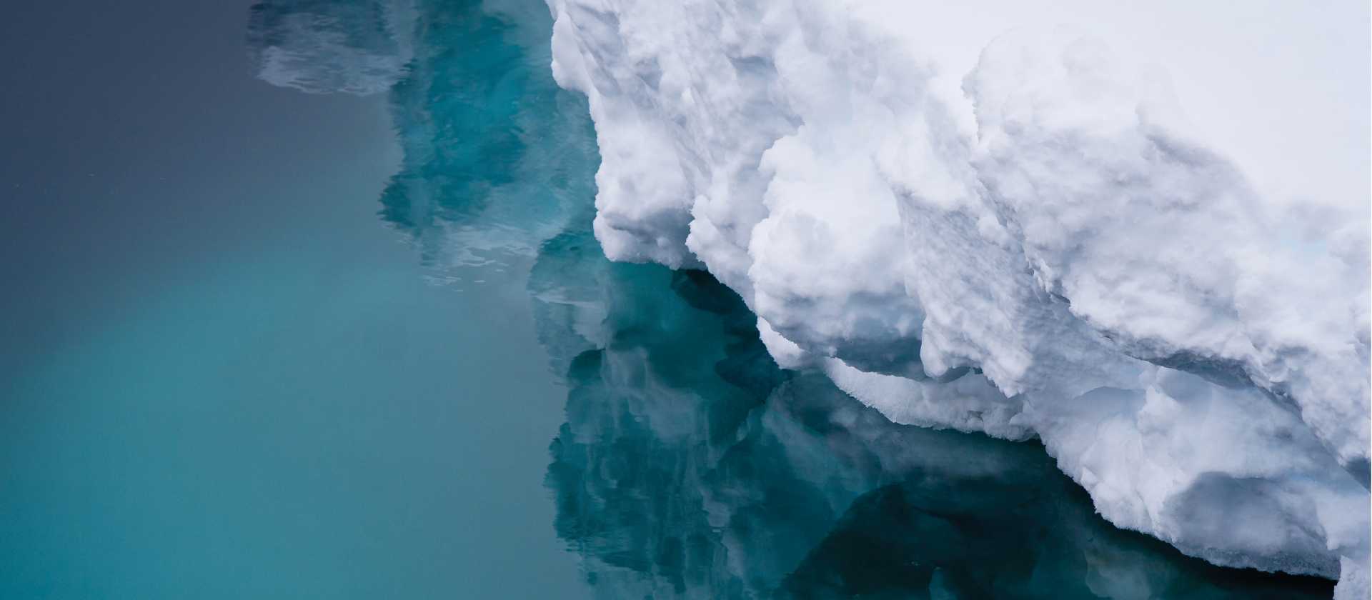 Reflections of an iceberg, Commonwealth Bay, Antarctica | Kylie Jones