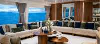 The comfortable lounge area with large windows to take in the view