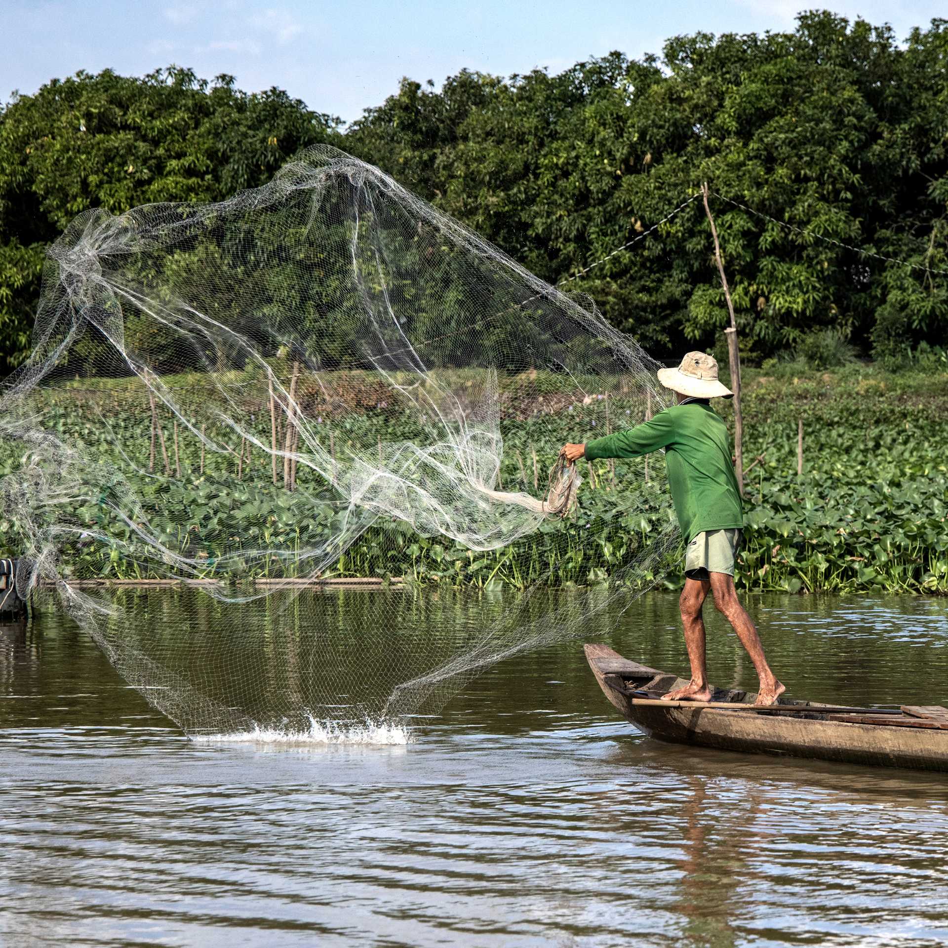 A local fishing in the Mekong Delta
