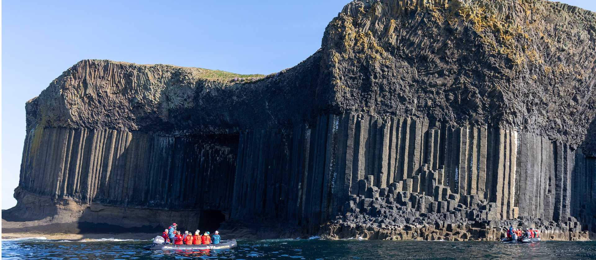 Zodiac cruising Fingal's Cave, Staffa Island | Piet van den Bemd