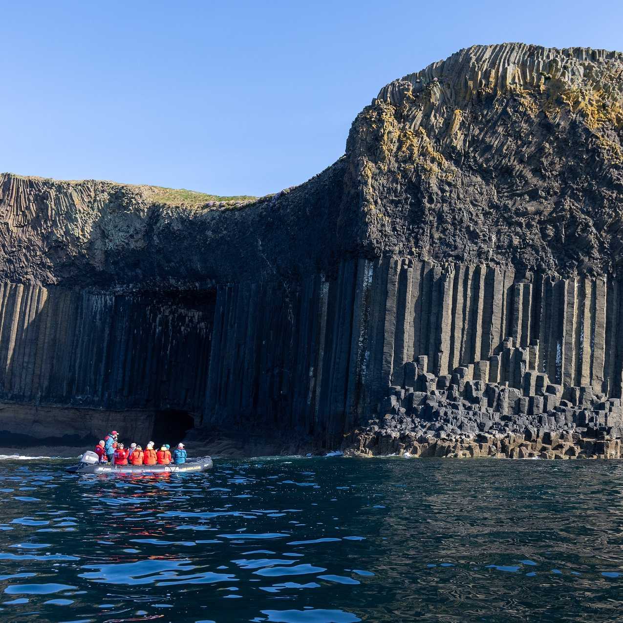 Zodiac cruising Fingal's Cave, Staffa Island | Piet van den Bemd