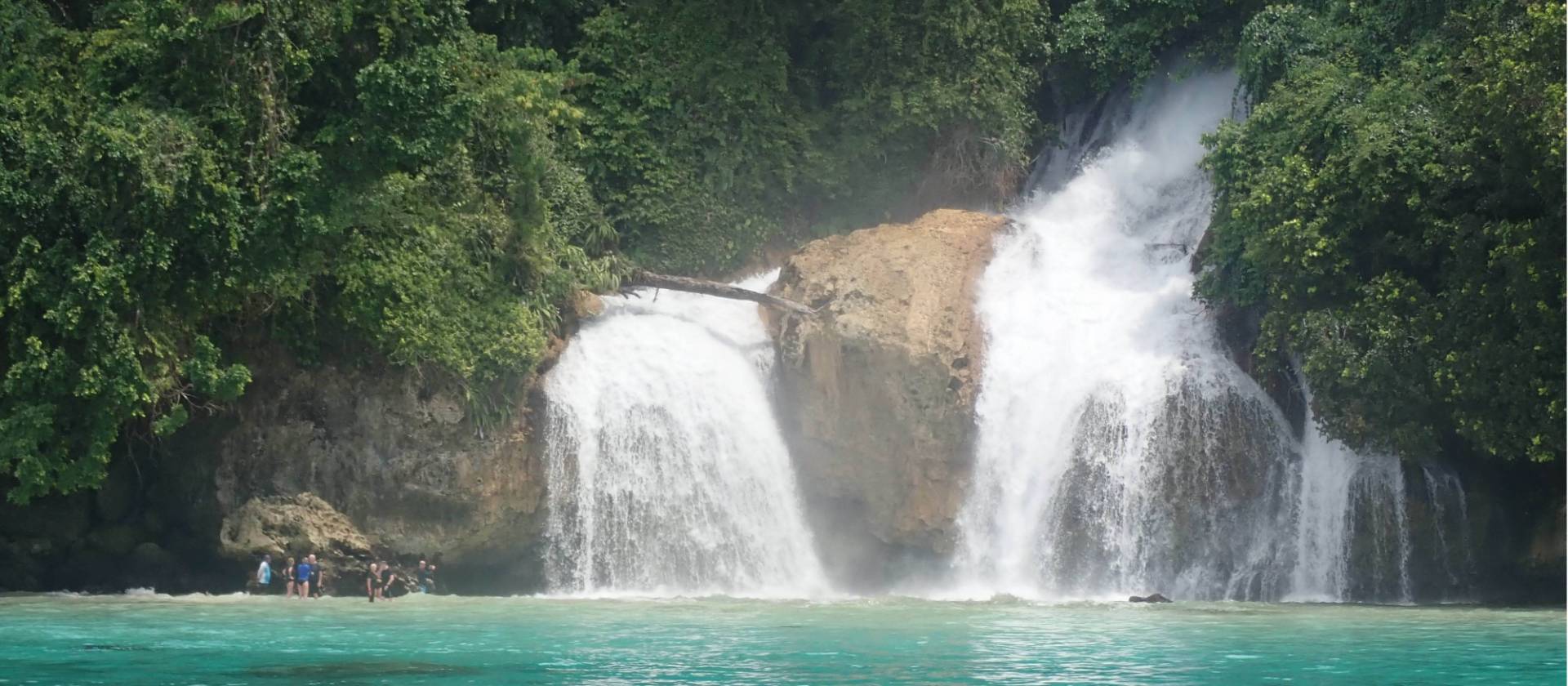 Kiti Kiti Waterfalls cascade into the ocean off the coast of West Papua