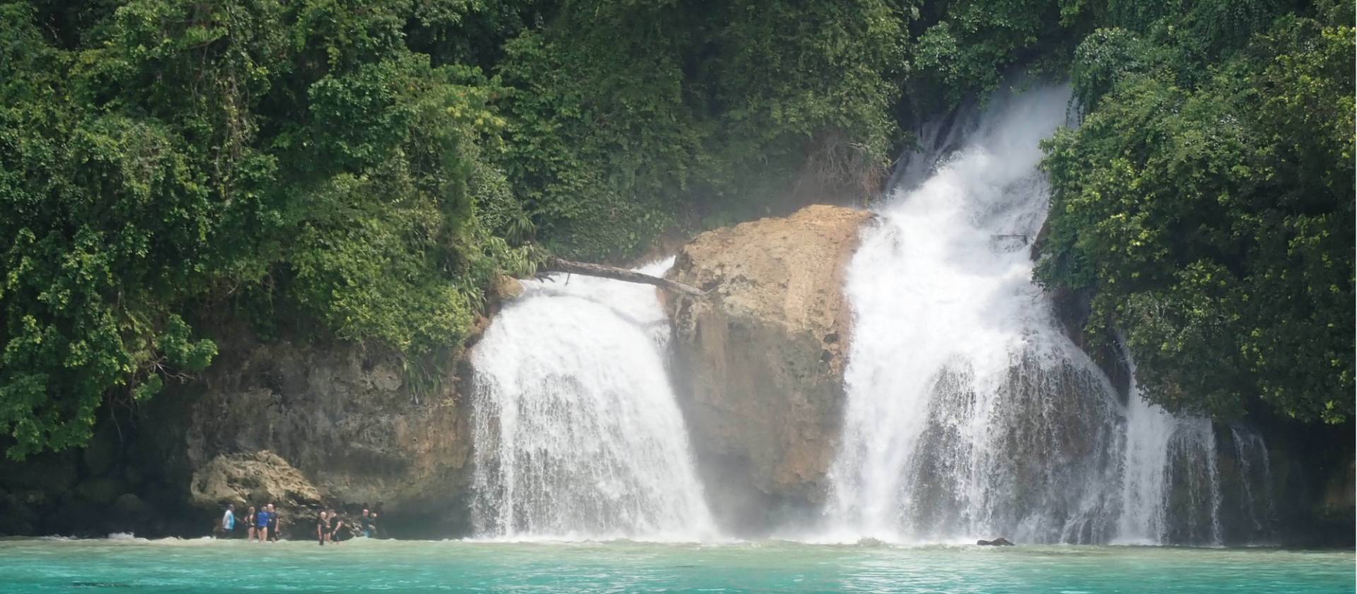 Kiti Kiti Waterfalls cascade into the ocean off the coast of West Papua