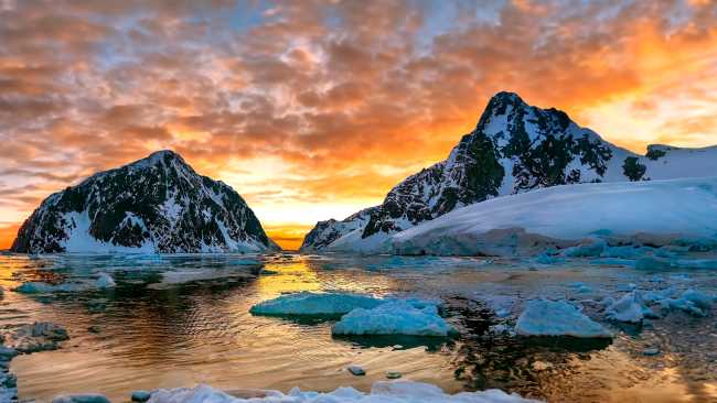 Midnight sun over the entrance to the Lemaire Channel
