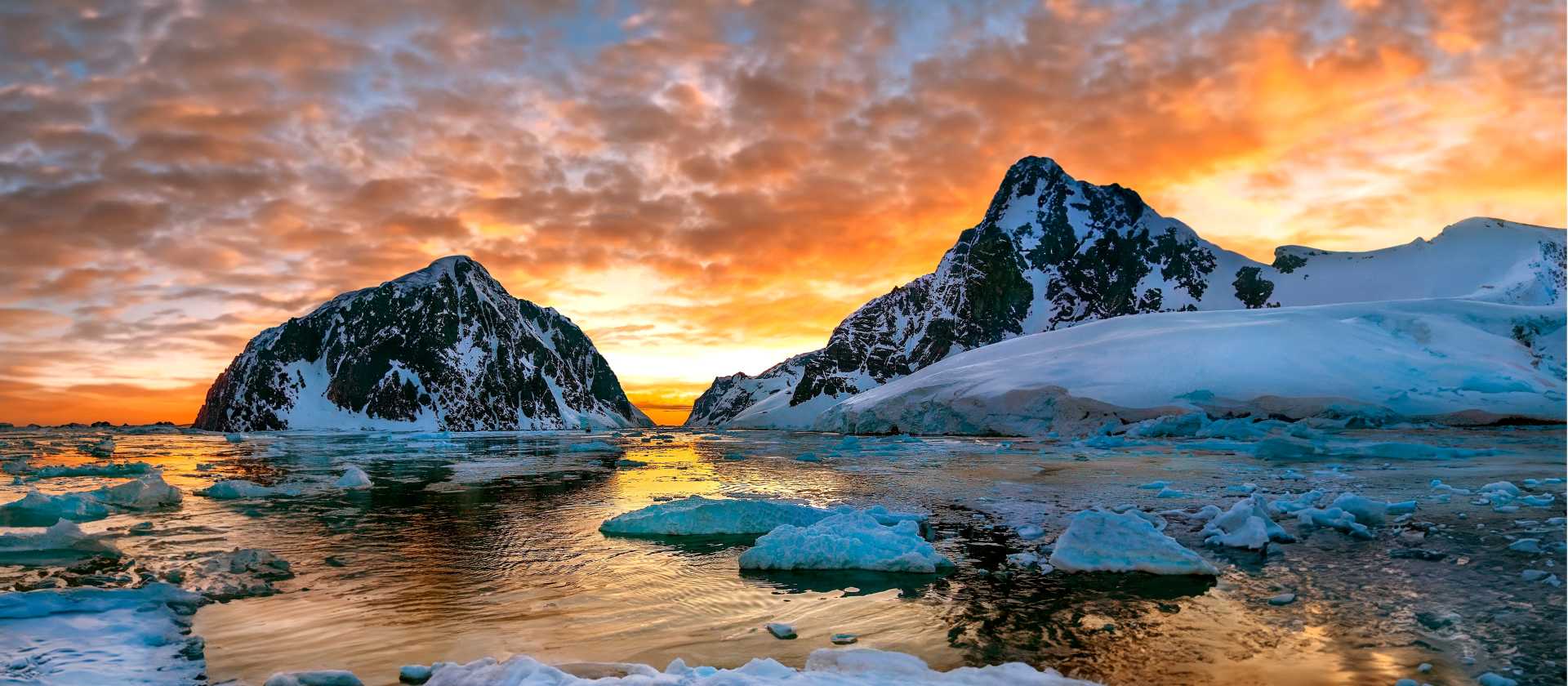 Midnight sun over the entrance to the Lemaire Channel