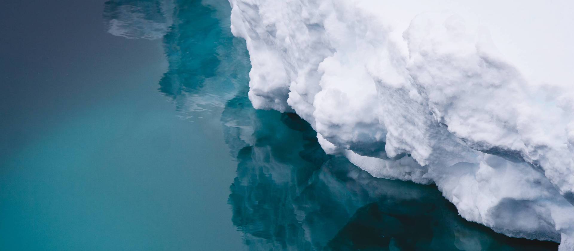Reflections of an iceberg, Commonwealth Bay, Antarctica | Kylie Jones