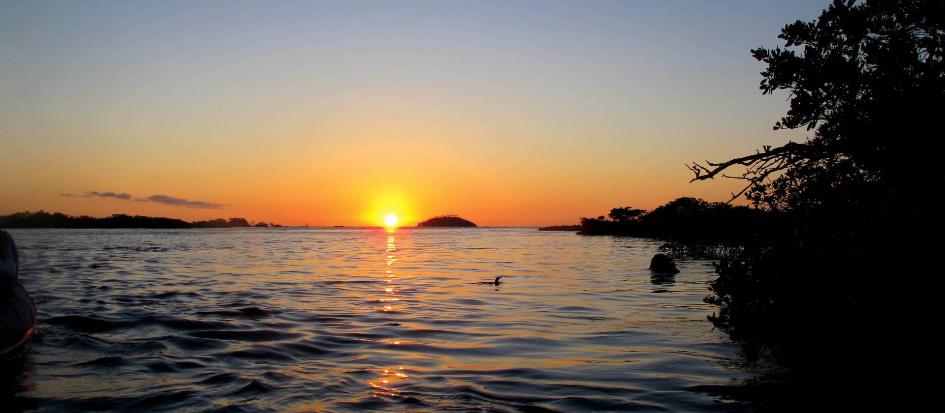 Breathtaking sunset from the beach front of Galapagos | Kate Harper